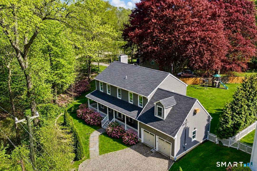 Welcome to 179 W Rocks Rd, a beautifully updated Colonial tucked away on a quiet private road in Norwalk's sought after Cranbury neighborhood on the border of Westport.
