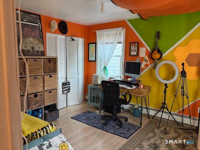 This well maintained East Rock two family house is on a quiet one way street.