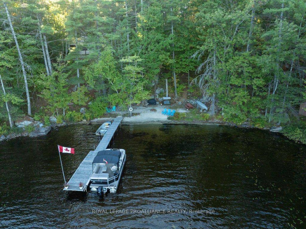 Discover your personal sanctuary at this enchanting lakefront retreat on the pristine shores of Hungry Lake, where 2.