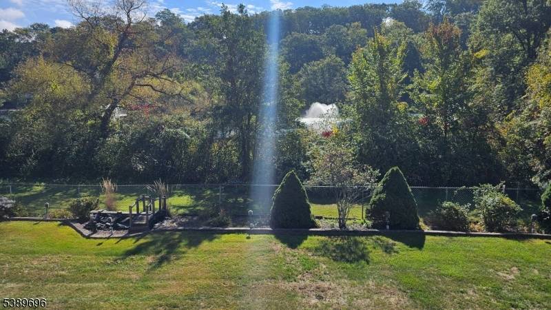 Custom, modular home backing to the fountain at Burnham Park offers formal living room, dining room, familiy room, kitchen, powder room and separate enclosed porch on the first floor, 4 ...