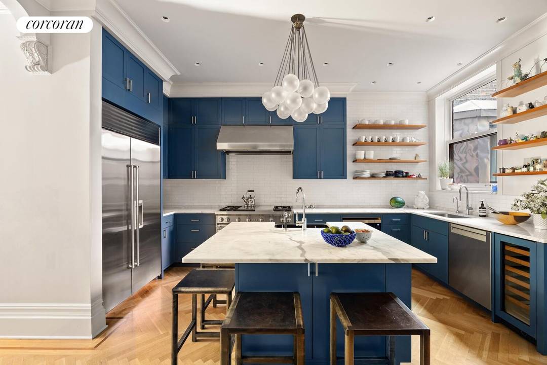Welcome to one of the neighborhood's most distinguished residences, 291 Clinton Avenue, a 5119 SF Romanesque Revival townhouse, masterfully reimagined for modern living.