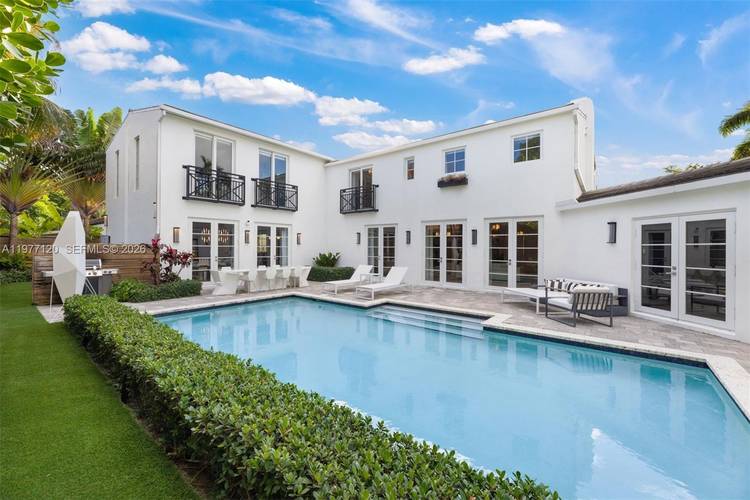 This luxurious Miami Beach estate presents a seamless blend of grandeur and chateau elegance.