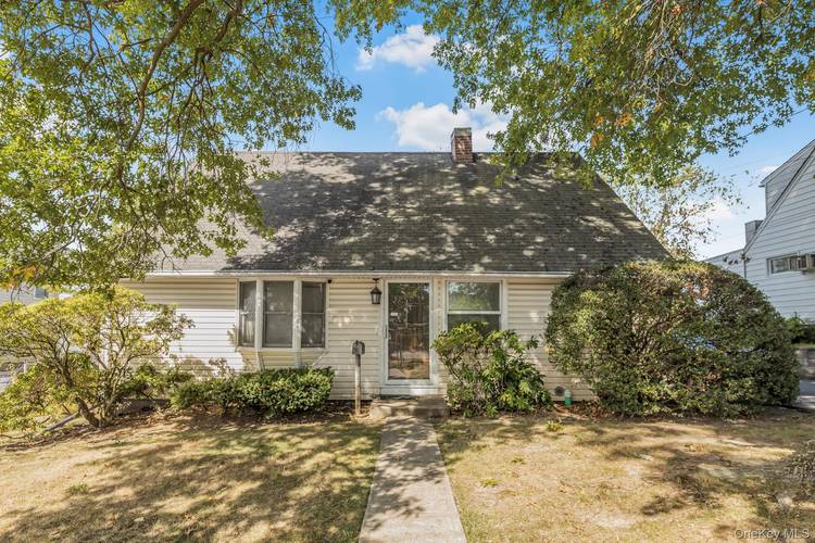 Charming Cape Cod in Sought After Sprain Lake Knolls Endless Potential Awaits !