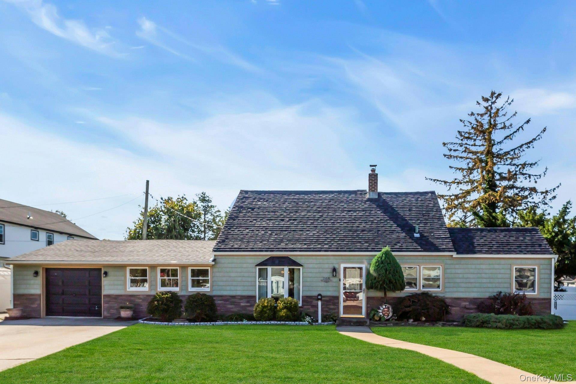 Welcome home to this iconic Levittown expanded cape, perfectly set on a charming corner lot in a quaint neighborhood.