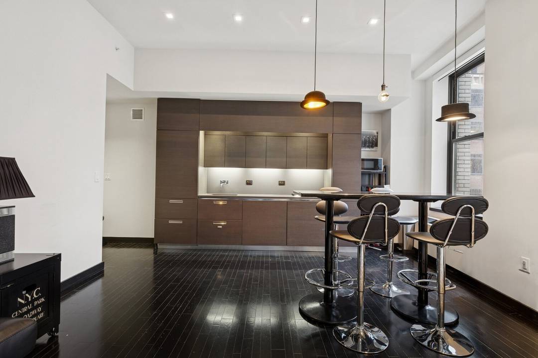Welcome to Apt 908 at The Collection at 20 Pine, a refined 1 bedroom, 1.