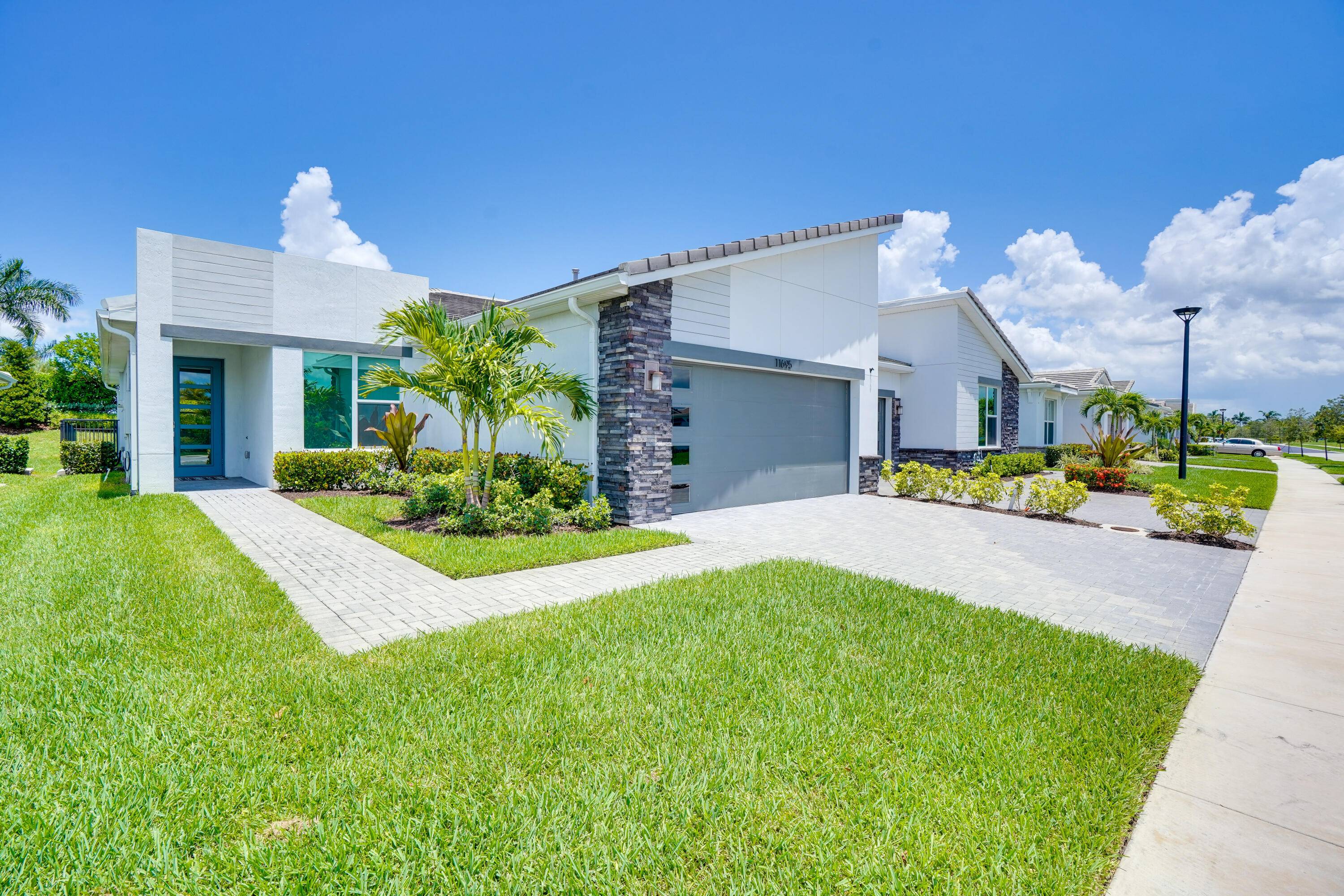 Stunning move in ready villa in the gated community of Telaro at Southern Grove in the heart of Tradition.