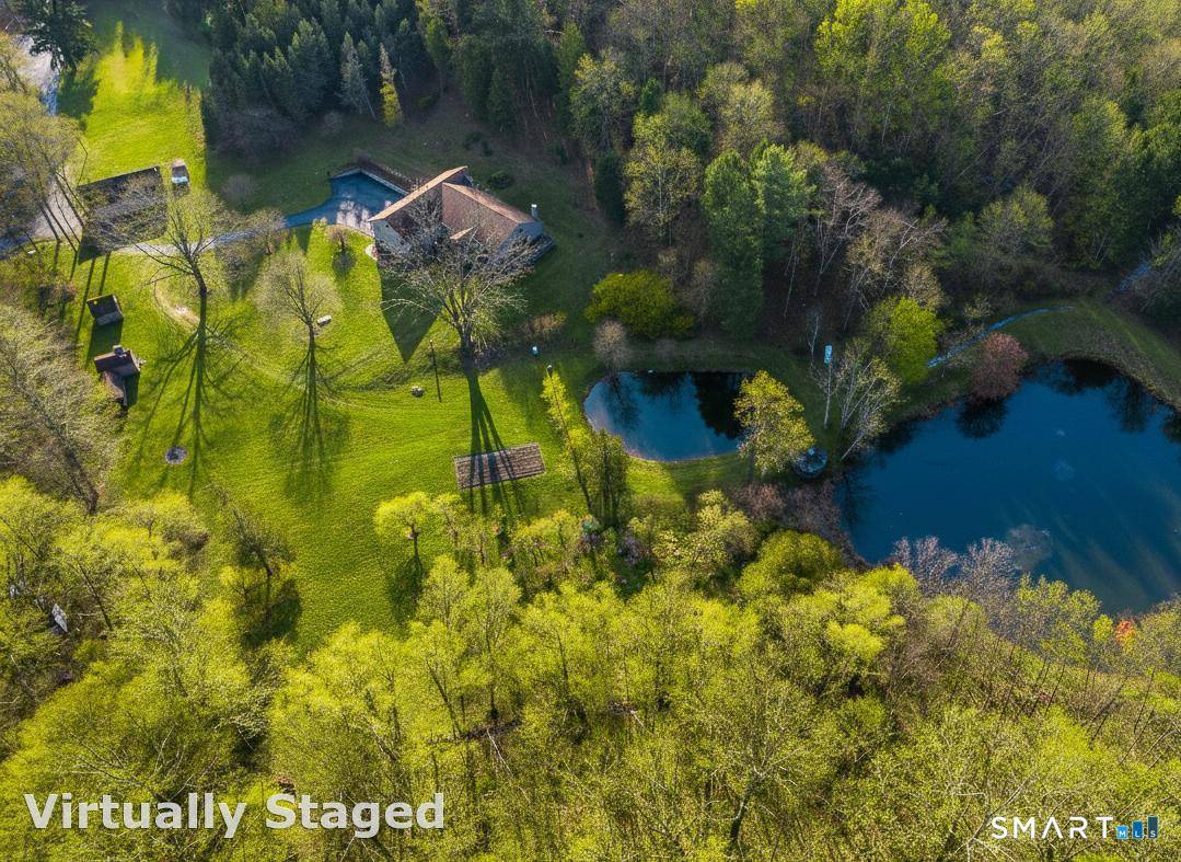 An incredible and rare opportunity awaits with this extraordinary 28 acre parcel, offering unmatched privacy, serenity, and timeless New England charm.