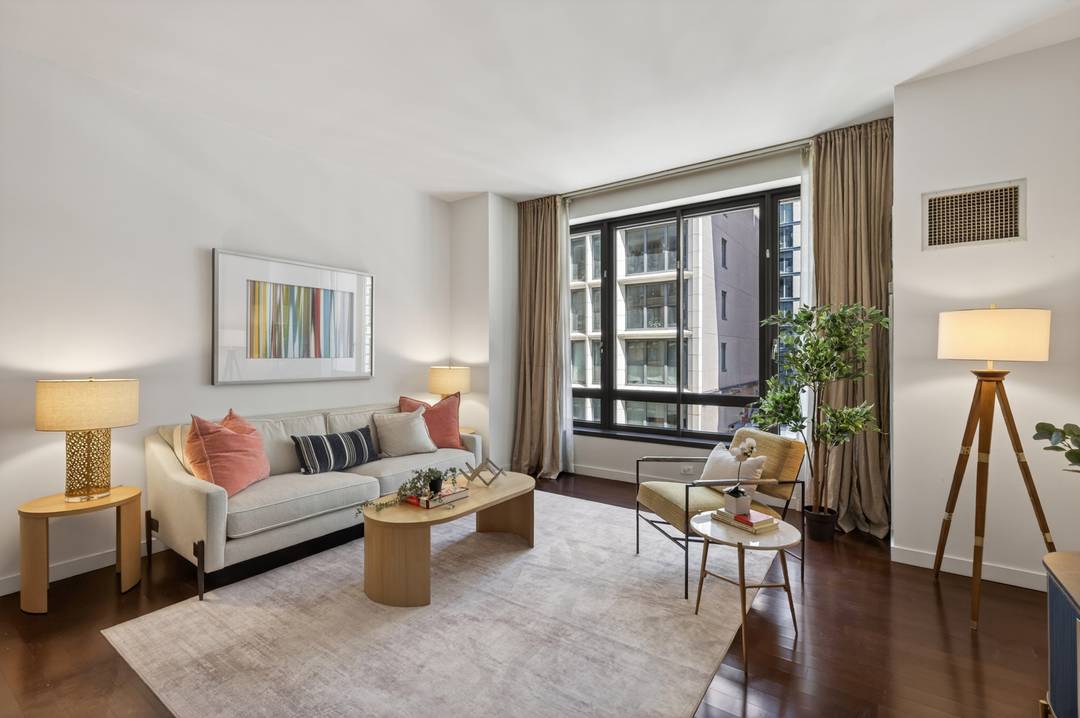Residence 7B at 4 West 21st Street is an enormous two bedroom with three full baths, washer dryer and central air conditioning in a luxury building with twenty four hour ...