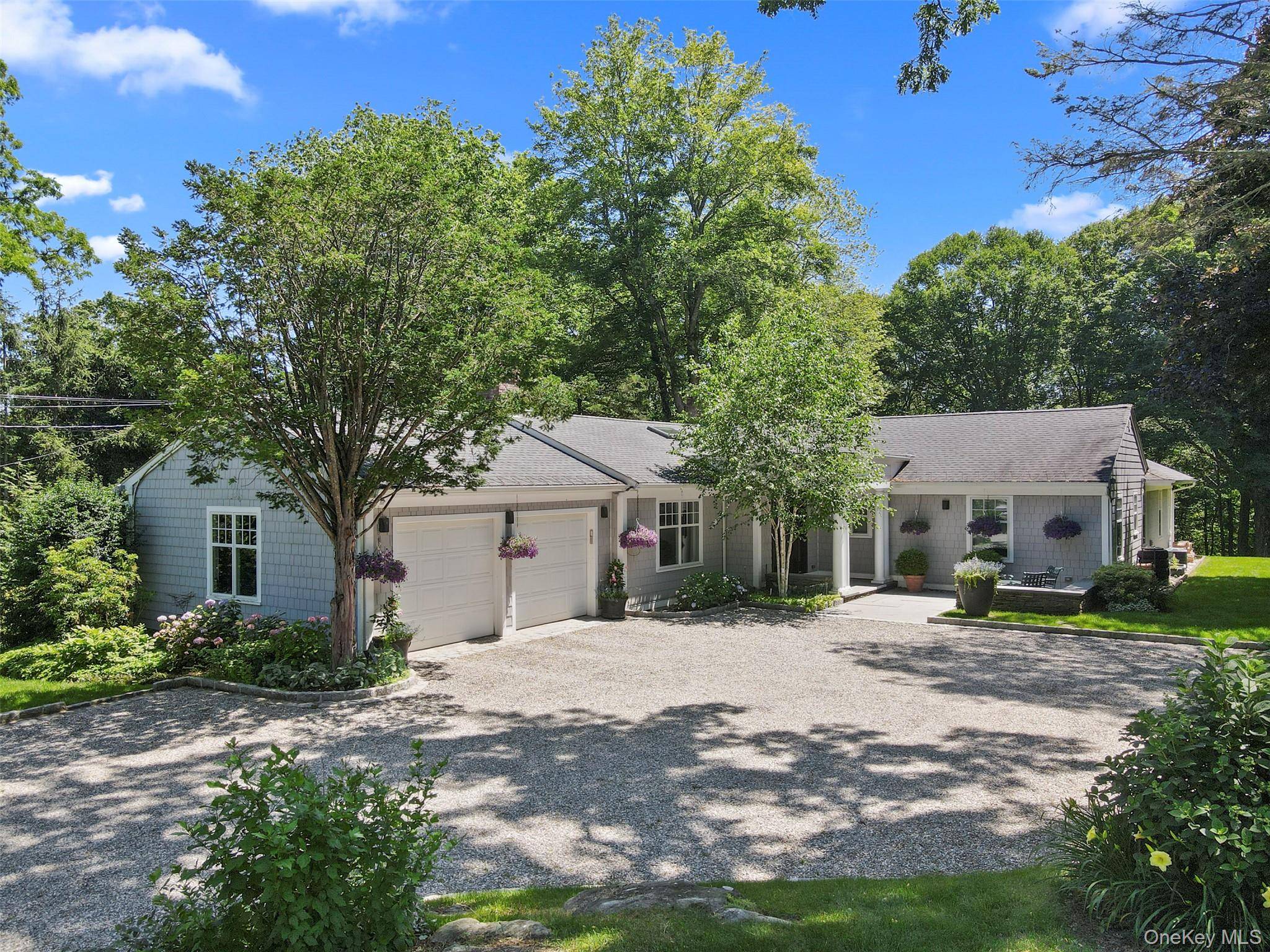 Completely renovated and expanded in 2018, this exceptional no step ranch blends modern luxury with timeless design.