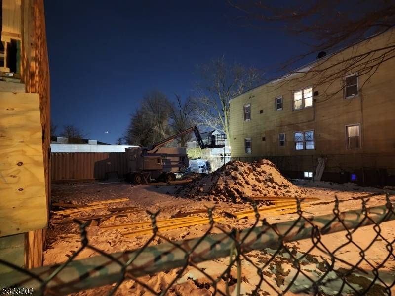 This is a brand new 3 family house under construction located next to Newark Liberty International Airport.