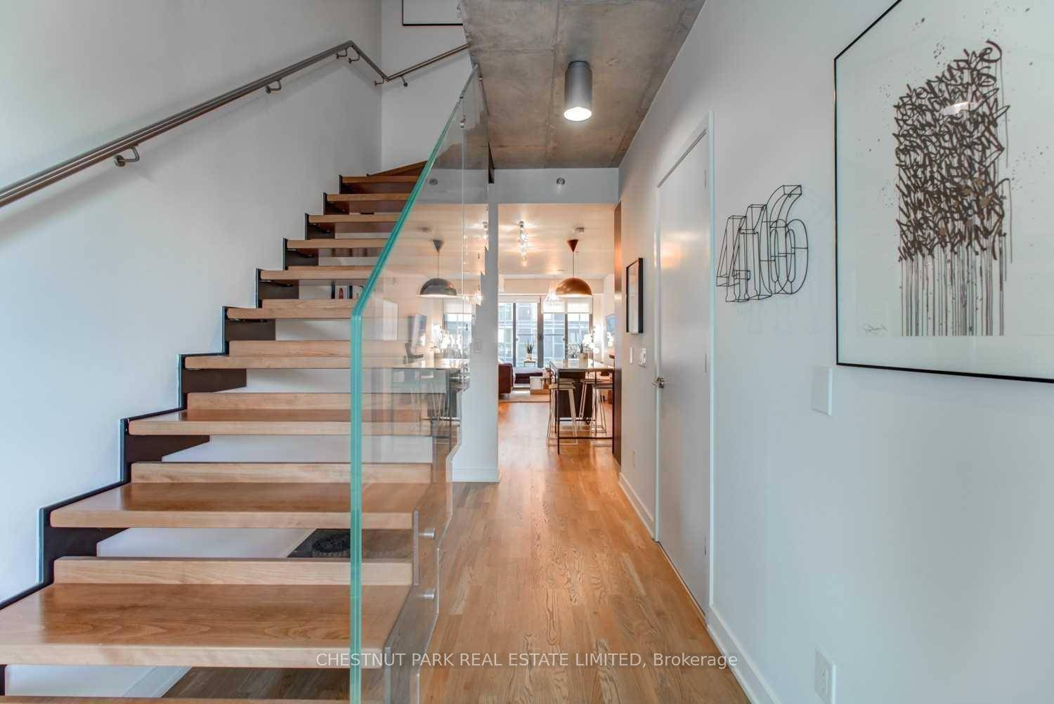 This 2 storey, open concept condo townhouse in trendy Little Portugal is a true showstopper !