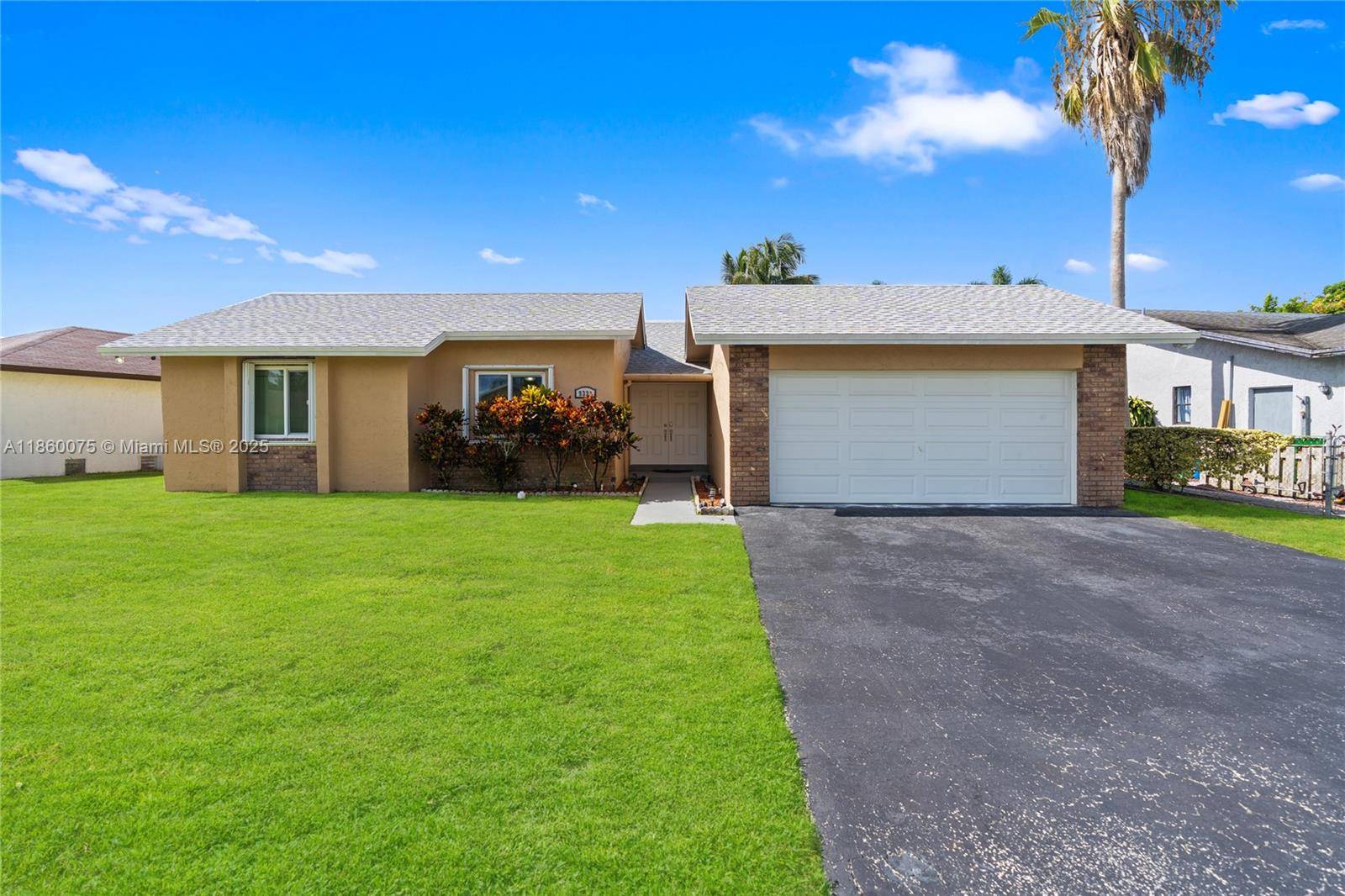 SPACIOUS 3 BEDROOM 2 BATHROOM HOME WITH A 2 CAR GARAGE LOCATED IN A VERY DESIREABLE AREA !