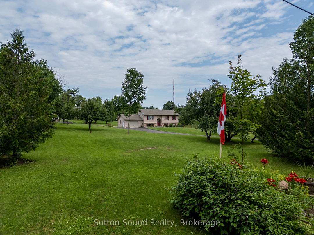 Set on nearly 2, private acres between Owen Sound and Wiarton, this well kept raised bungalow offers the space, flexibility, and outbuilding so many buyers are searching for.