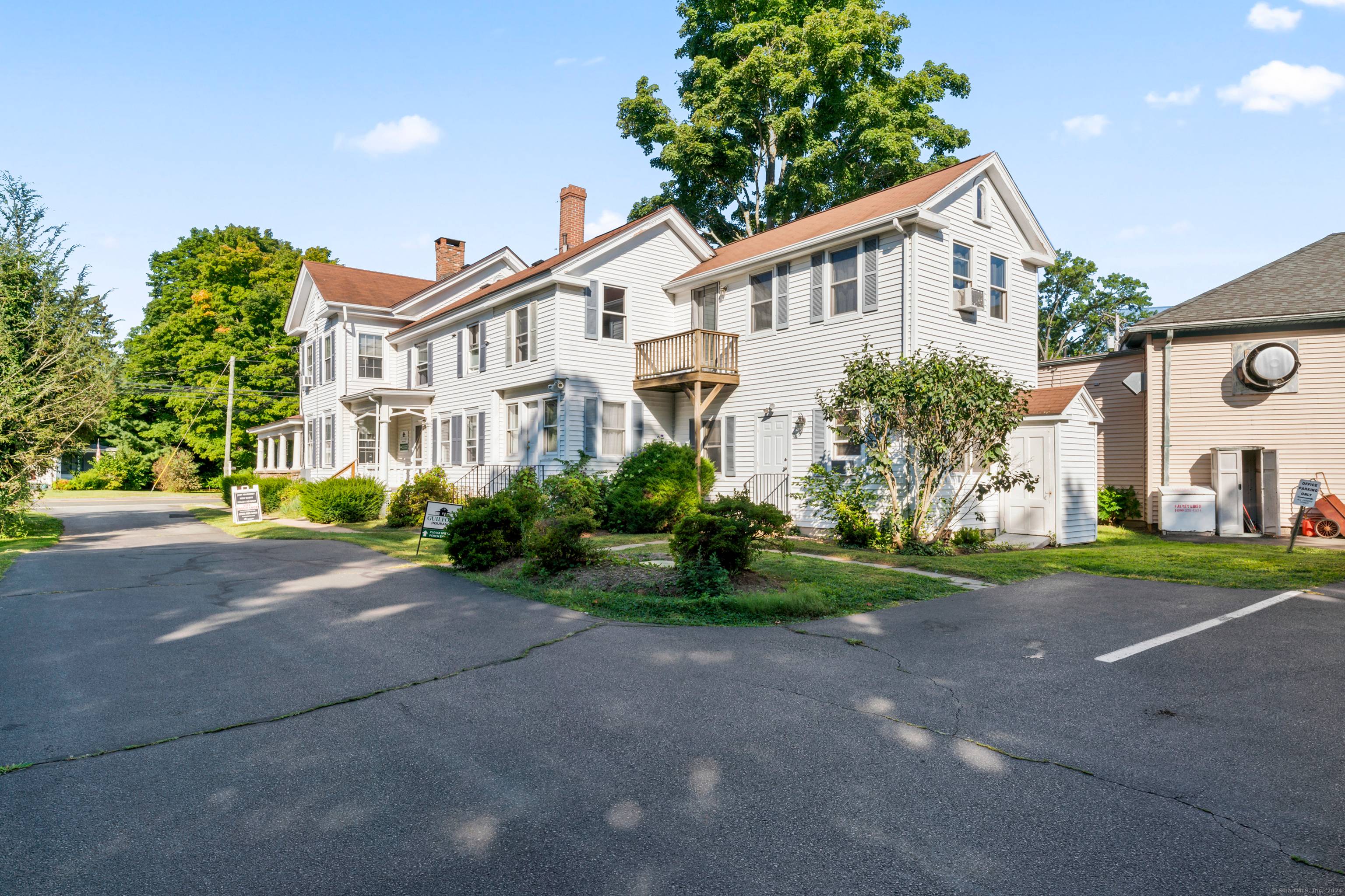 Fully leased Mixed Use commercial building in historic downtown Guilford location with three office suites and a large apartment.