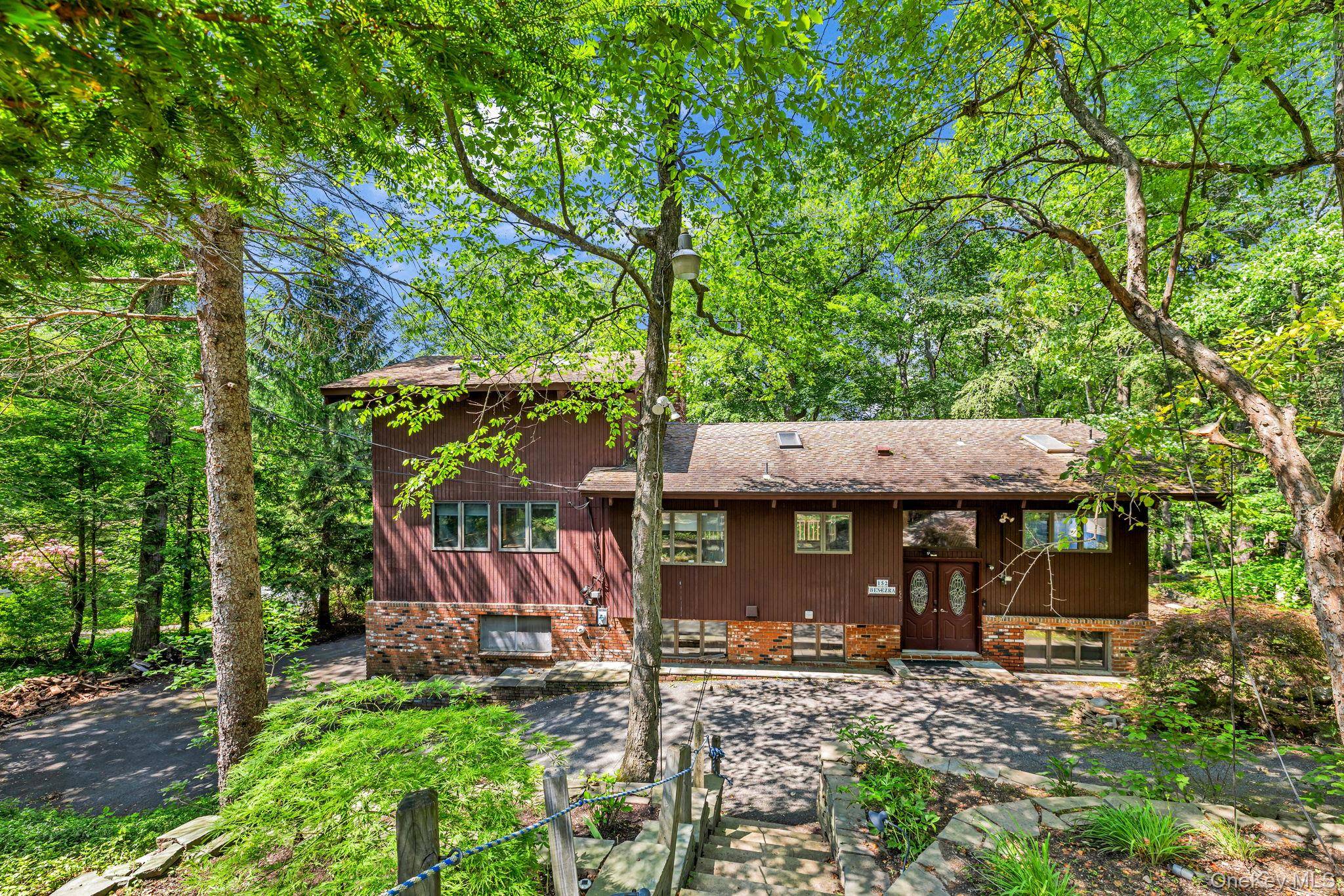 TUXEDO ! Mid Century Scenic Country Retreat Nestled among the trees in the sought after Laurel Ridge community, this custom home blends rustic charm with contemporary design.