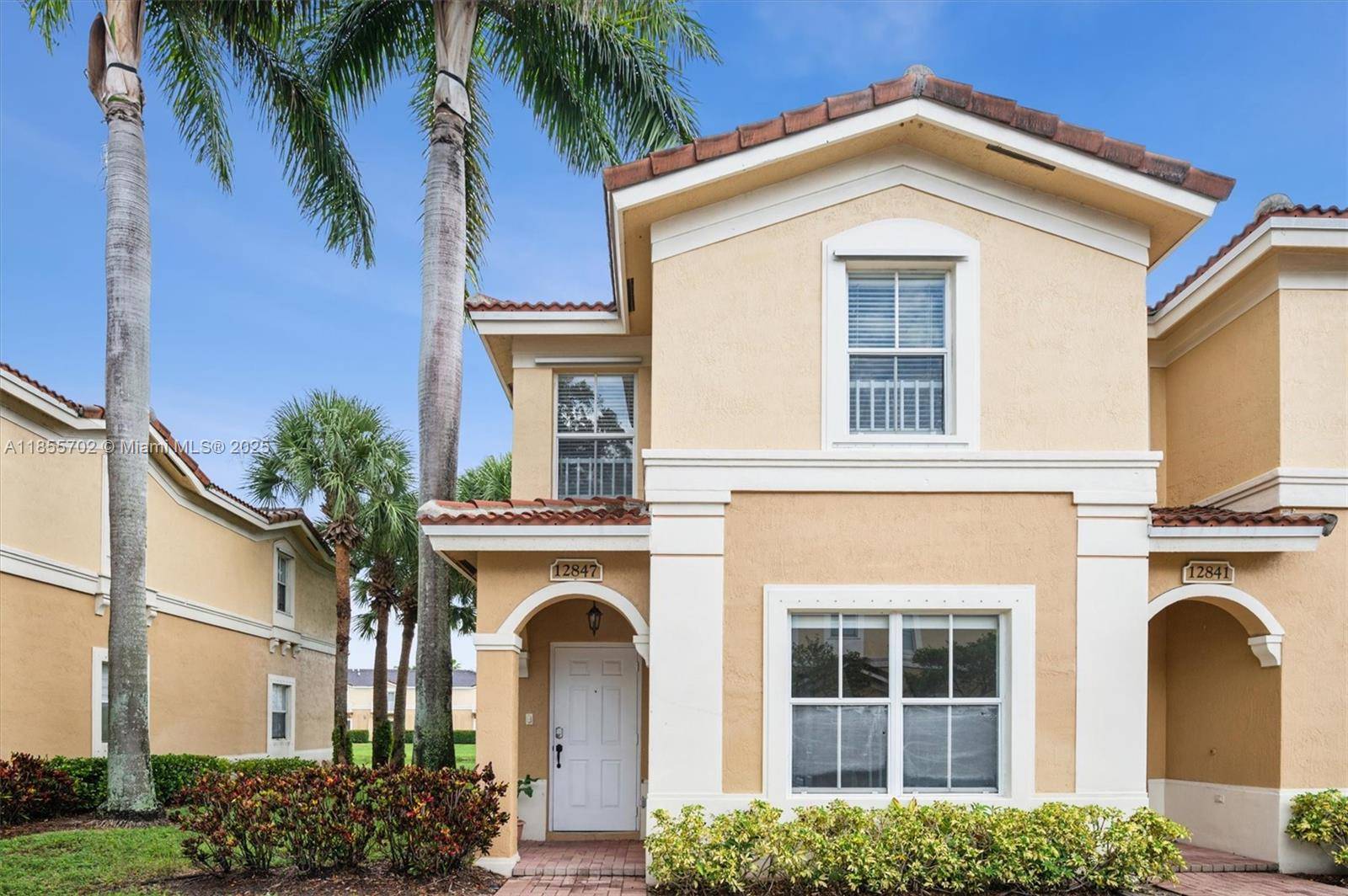 Welcome to this beautifully updated corner townhome with serene lake views light filled with 3 spacious bedroom and 2.