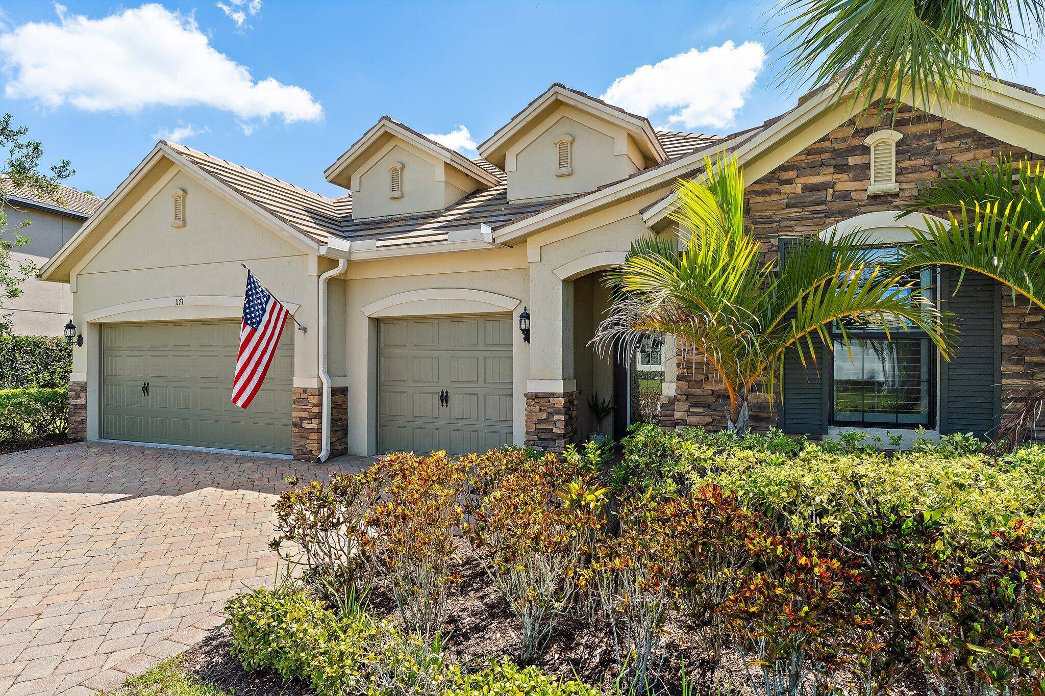 Nestled in Palm City's gated Copperleaf community, this concrete block 4 bed 3 bath home offers contemporary style and privacy.