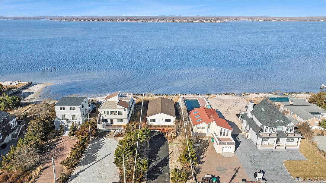 Build or renovate your own dream house on iconic Dune Road in Westhampton an exceptional bayfront opportunity with both bay and ocean access.