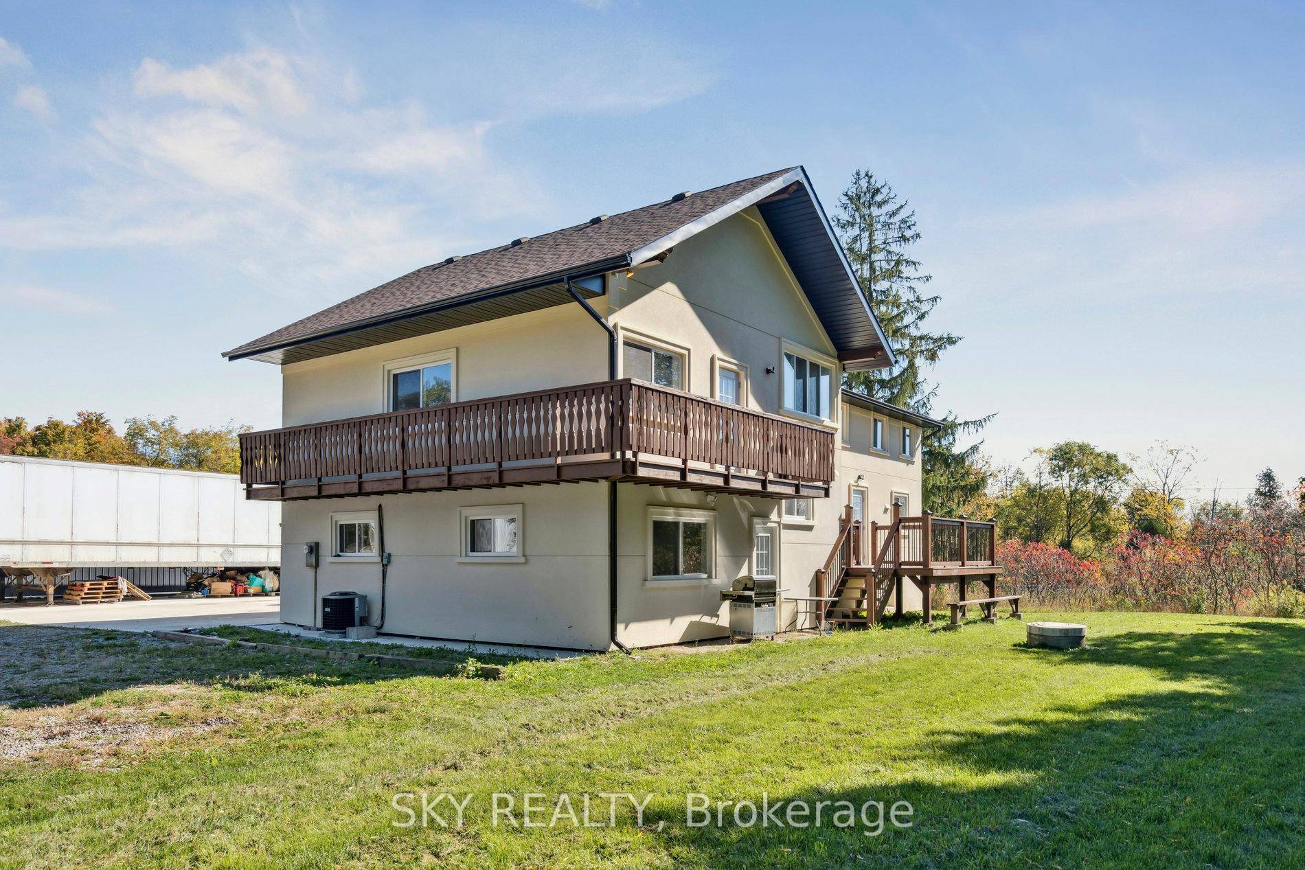 Unique 1 acre property featuring a Renovated 3 bedroom house and freestanding 9000 sq ft Commercial industrial Building with a 2 Legal bedroom unit above the warehouse.