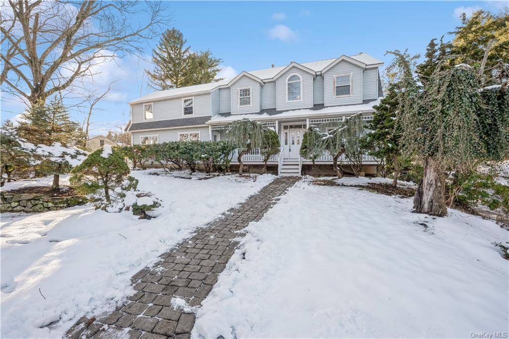 New City, NY Welcome to this spacious, luxurious colonial style home surrounded by lush greenery, with a stunning in ground pool.