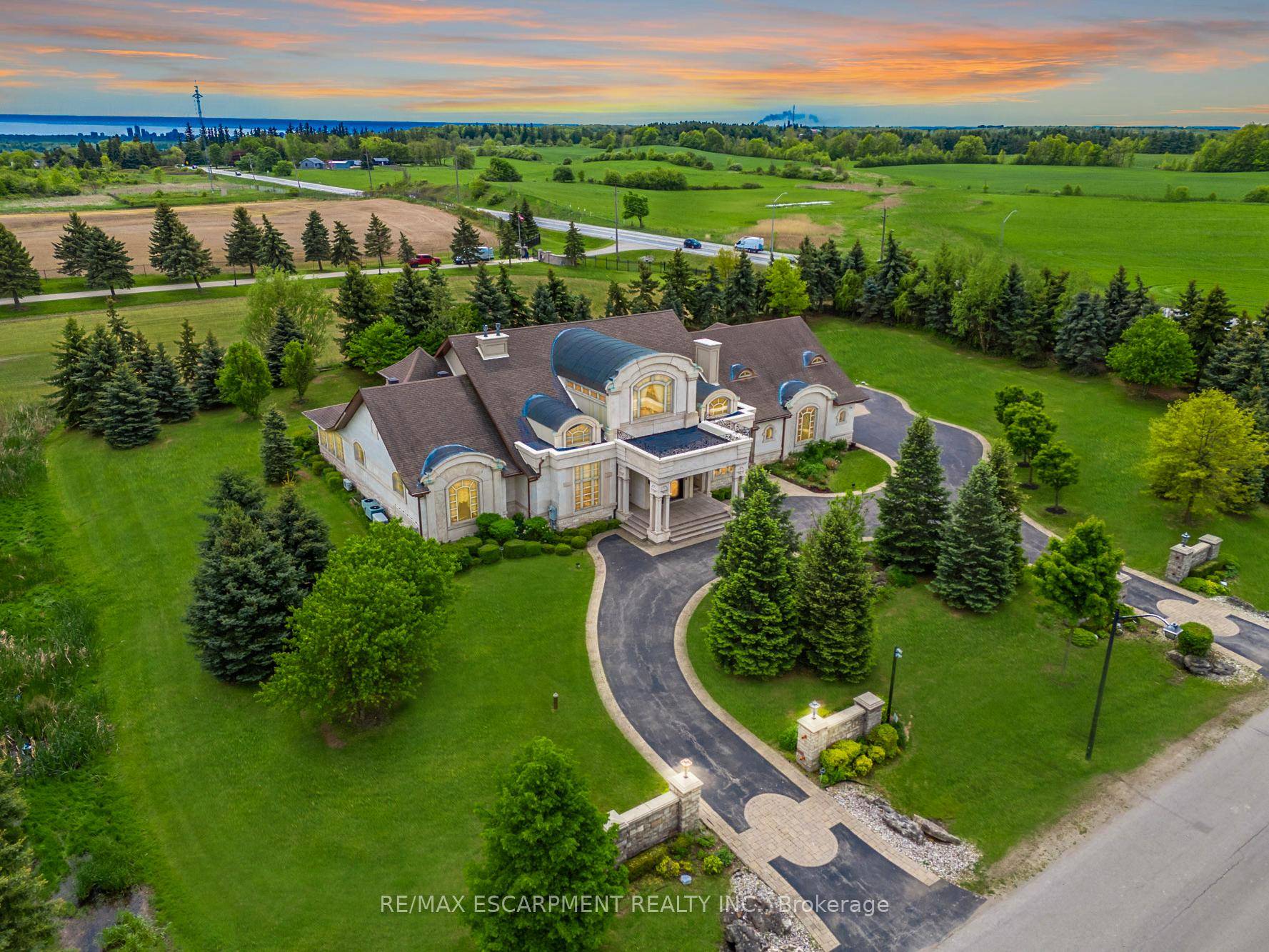 Impeccably nestled in The Bluffs, this extraordinary estate spans over 11, 000 sqft.