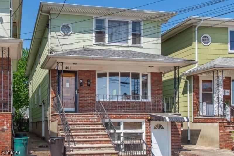 This two family duplex in Harrison, New Jersey, is ideally situated just a few blocks from the train station, making it a convenient location for commuters.