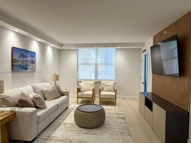 LEGALLY CONVERTED AND FULLY RENOVATED 2 2 FEATURING CUSTOM FINISHES AND FURNISHINGS WITH BRAND NEW A C, AND ALL BUILT IN CUSTOM CABINETRY !