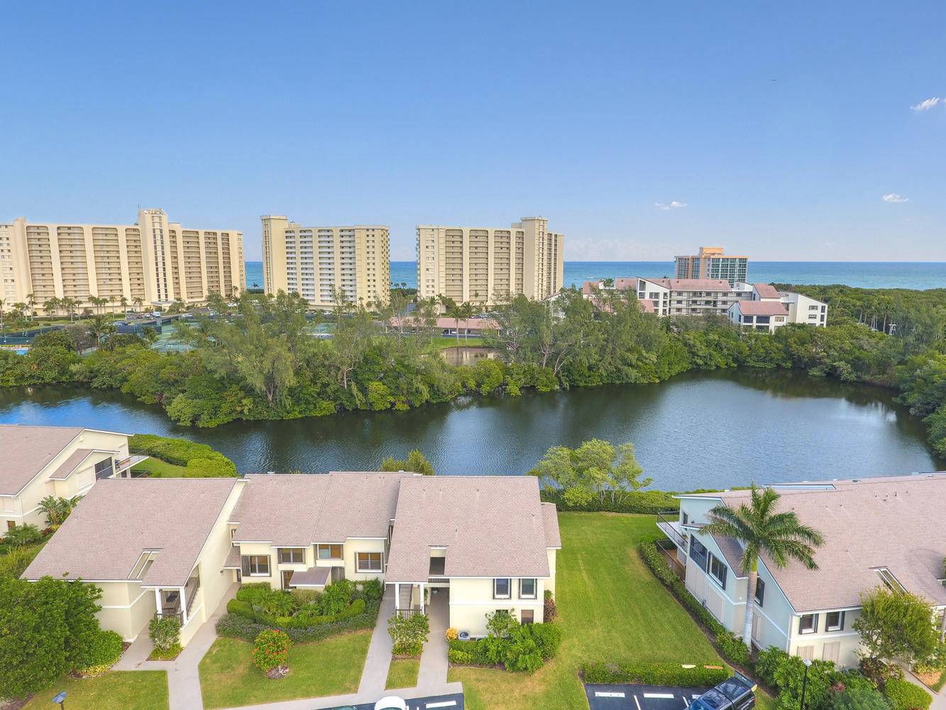 Walk to the turquoise waters of Jupiter Beach from this 2nd floor, 2 bedroom, 2 bath waterfront condo on Jupiter's natural estuary.