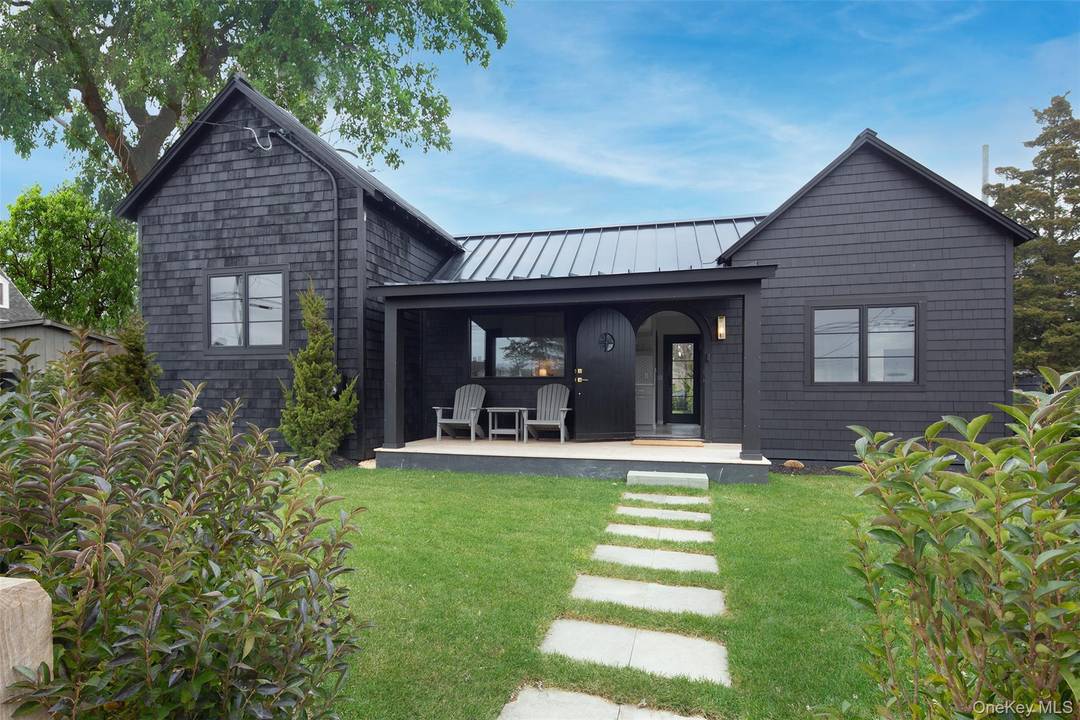 This adorable renovated two bedroom, one bath home with wood floors, kitchen, laundry, and a beautiful rear yard comes completely furnished, even with a gas grill and fire pit.