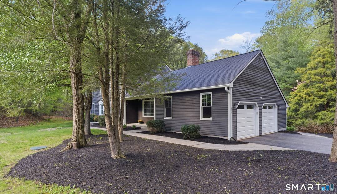 Tucked away in a peaceful, park like setting in desirable North Granby, this beautifully updated 4 bedroom, 2.