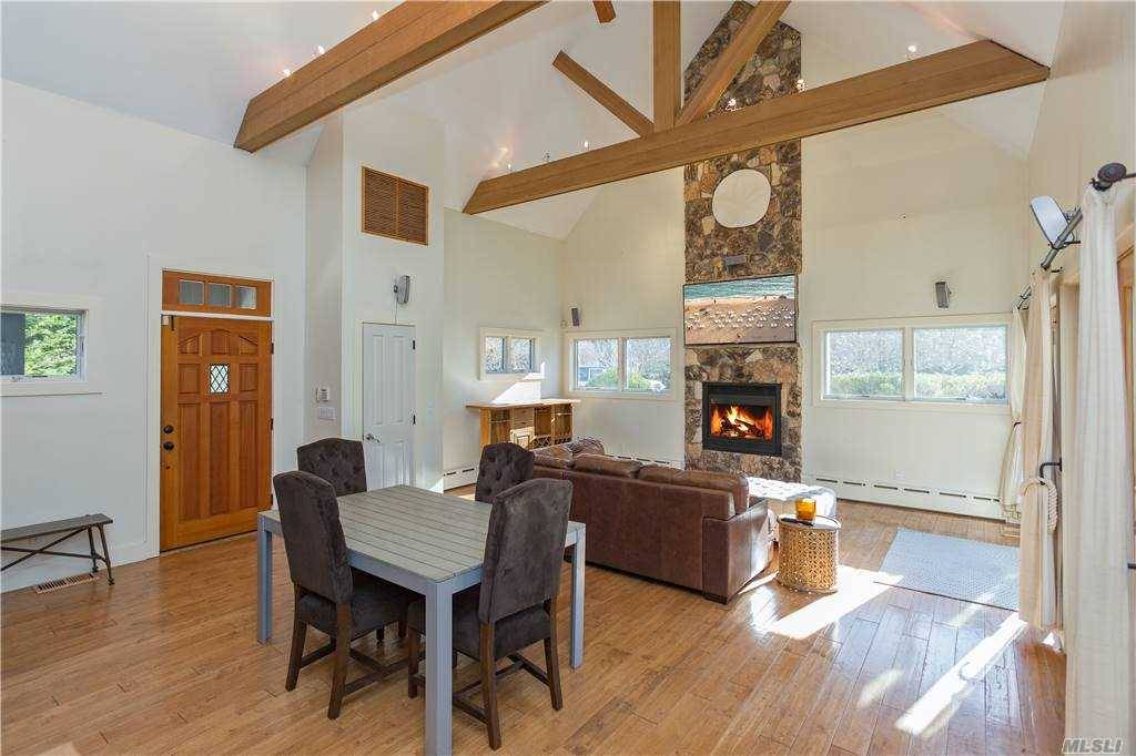 This beautiful turnkey 2 bedroom home with a bonus room has cathedral ceilings that open to a gourmet kitchen.