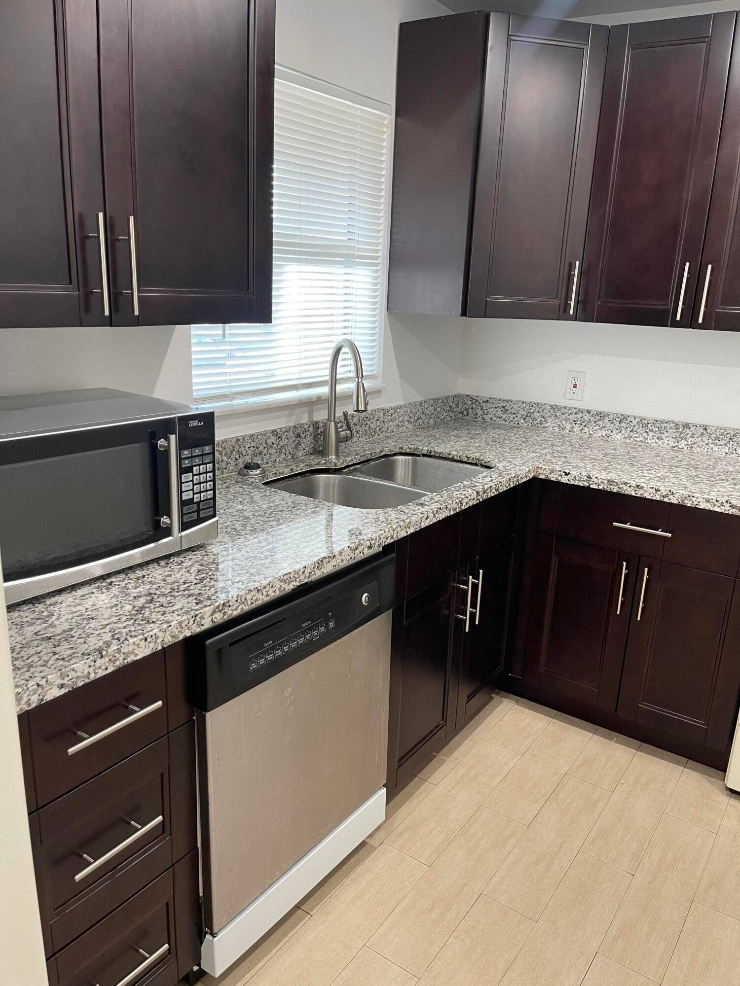 This private Corner unit features 2 Bedrooms, 2 Bathrooms with recent updates to include Kitchen countertops, cabinets and appliances.