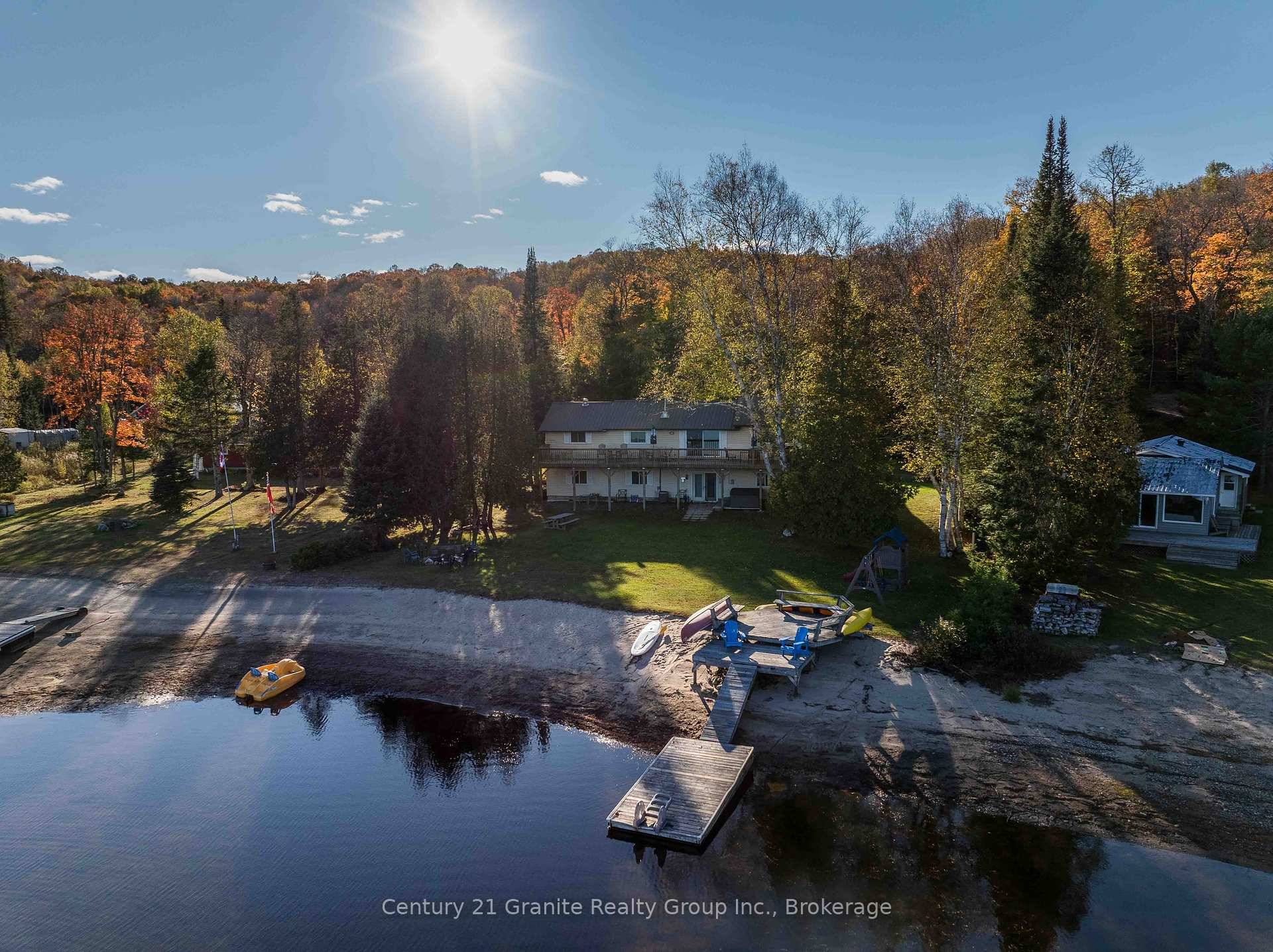Wake up to sunrise views over Haliburton Lake, spend your afternoons swimming from your private sandy shoreline, and end the day soaking in your own lakeside hot tub.