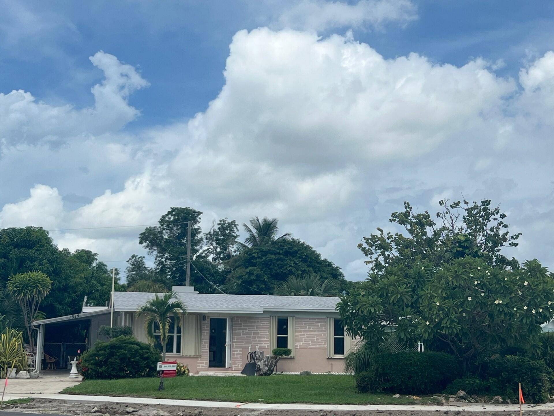 NO HOA or CARPET ! New Roof and recently renovated 4 bedrooms, 2 bathrooms, single family home on corner lot with extended carport BRING YOUR BOAT.