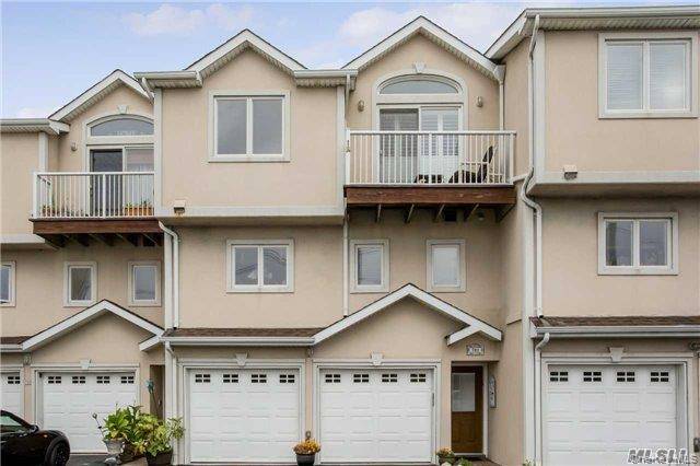 Bayfront Townhouse blocks from the ocean with deeded boat slip in your yard.