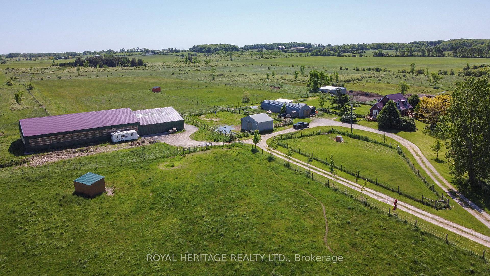 Beautiful Equestrian Hobby Farm with a Tree Lined Driveway Leading to 103 Acres, Surrounded by Serene Fields.