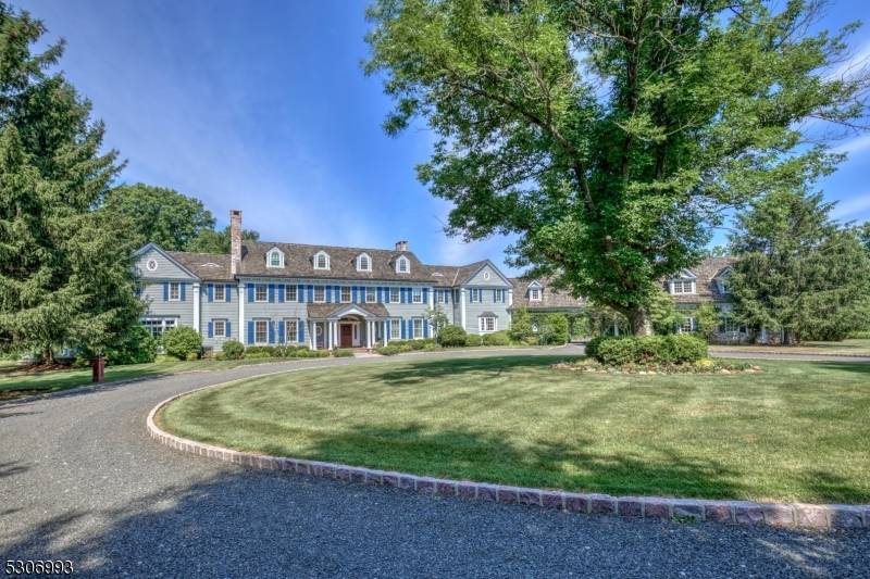 Set on 44 open, rolling acres in Bedminster Hunt Country, an exceptional gated Colonial Revival estate with equestrian facilities is set along one of the township's most desirable lanes.