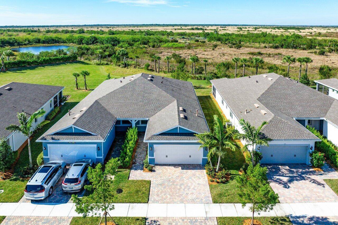 Discover this stunning 2 bedroom, 2 bathroom CBS villa w flex room plus 2 car garage, nestled against a serene preserve in the brand new gated community of Del Webb ...