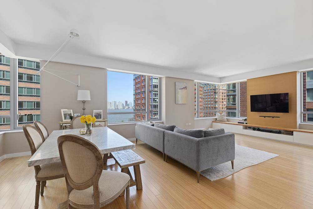 Sprawling three bedroom four bath apartment in the Riverhouse, the only LEED certified green water front condominium in North Battery Park West Tribeca.