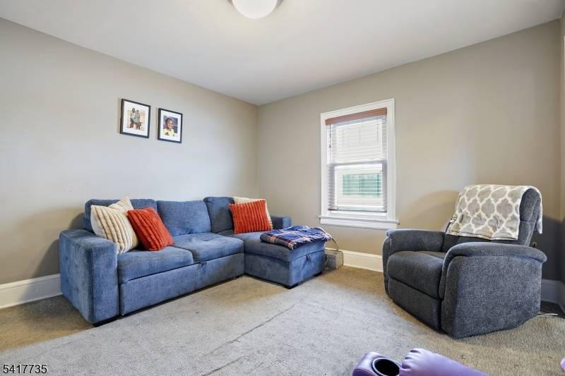 BEAUTIFUL, LARGE, TOTALLY RENOVATED OVER UNDER 2 FAMILY IN AN INCREDIBLE LOCATION NEAR BUS STOP AND ALL MAJOR TRANSPORTATION WITH A 2 CAR GARAGE, NEW ROOF, NEW SIDING, NEW KITCHENS ...