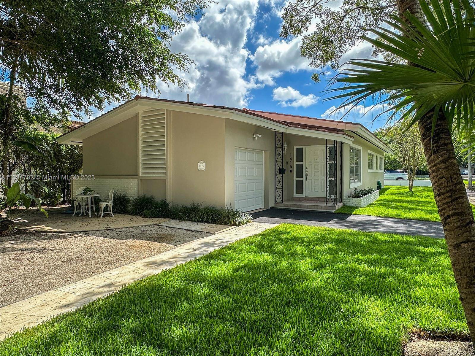 Located on a quiet corner lot in North Coral Gables close to Country Club Prado.