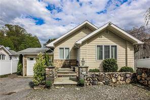This home, situated in the Upper North End of Stamford, features two bedrooms with the potential for a third in the finished lower level.