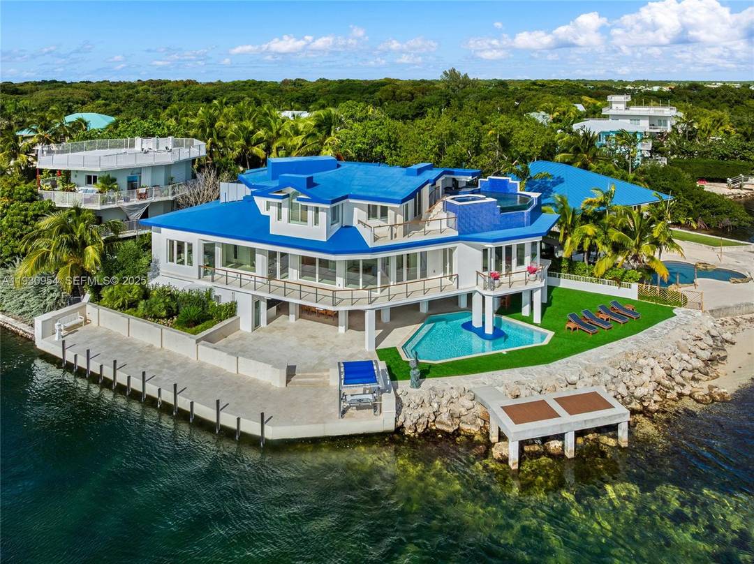 This 2 story estate sits on a 7, 300 SF point lot at the tip of Adam s Cut w 167 FT WF amp ; views to Largo Sound w ...