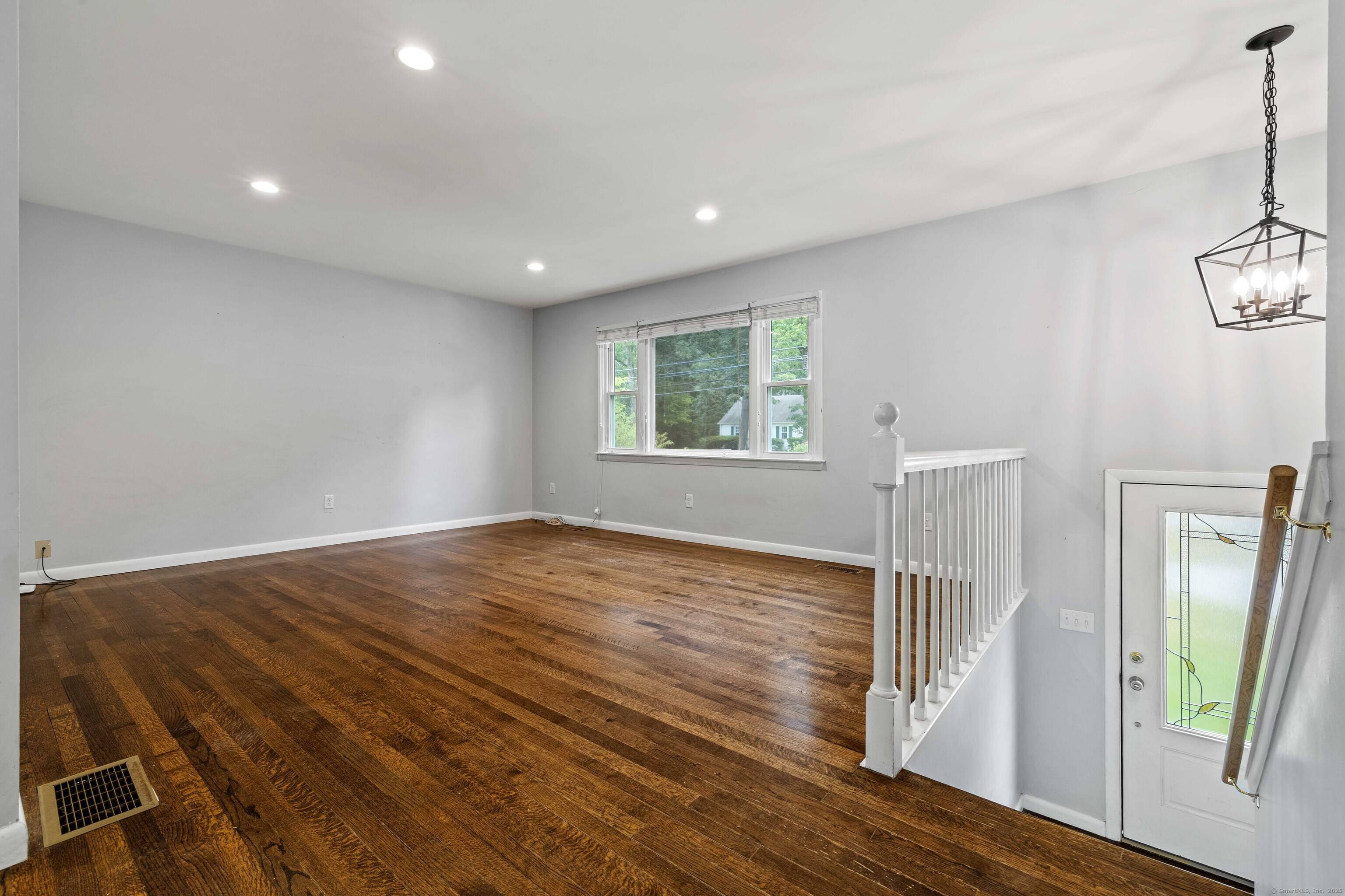Welcome to this charming raised ranch, ideally situated half a mile from downtown Niantic !
