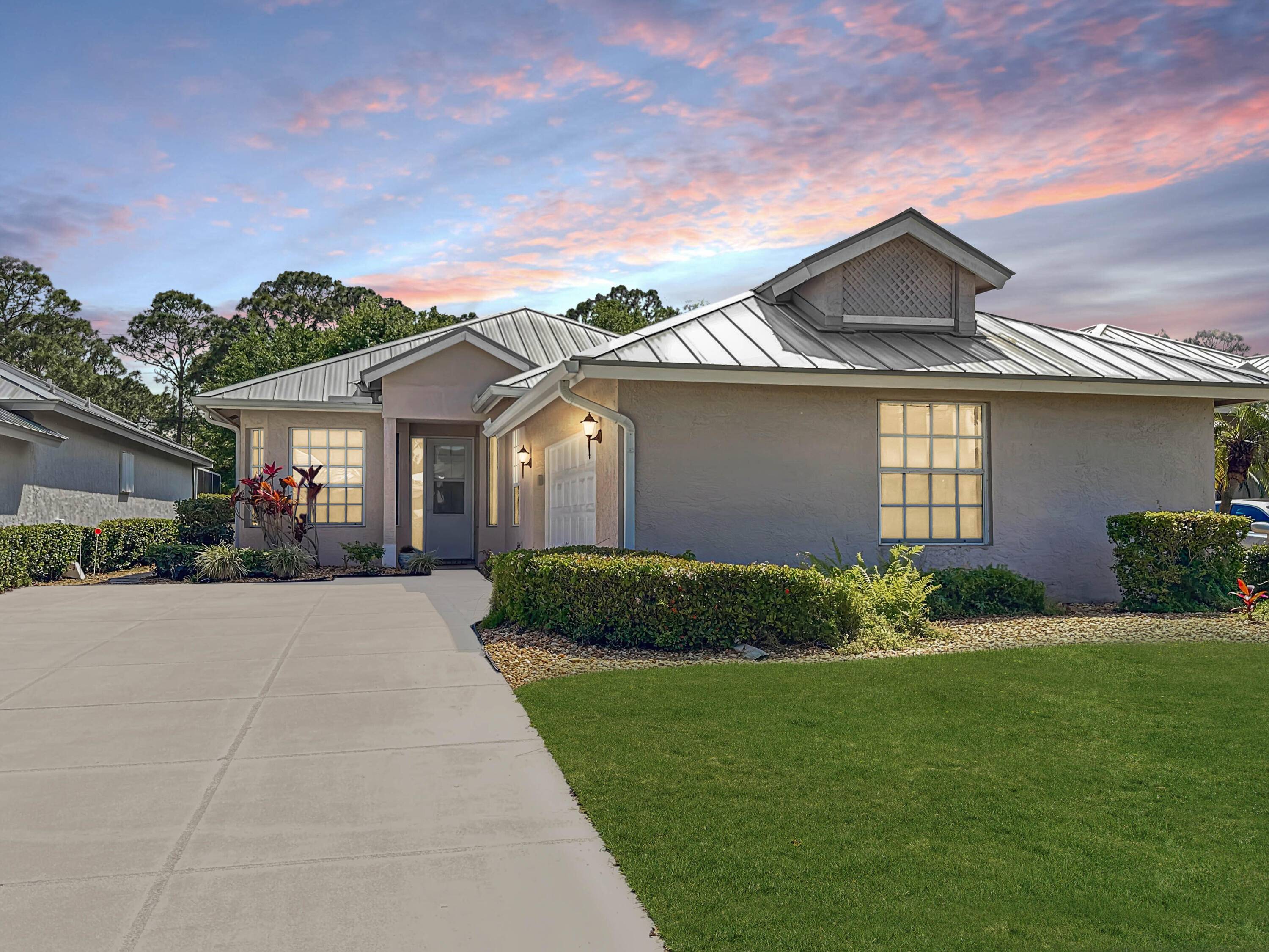 Welcome to 9435 Poinciana Ct, a stunning single family residence nestled in the esteemed Meadowood Golf Tennis Club in Fort Pierce, FL.
