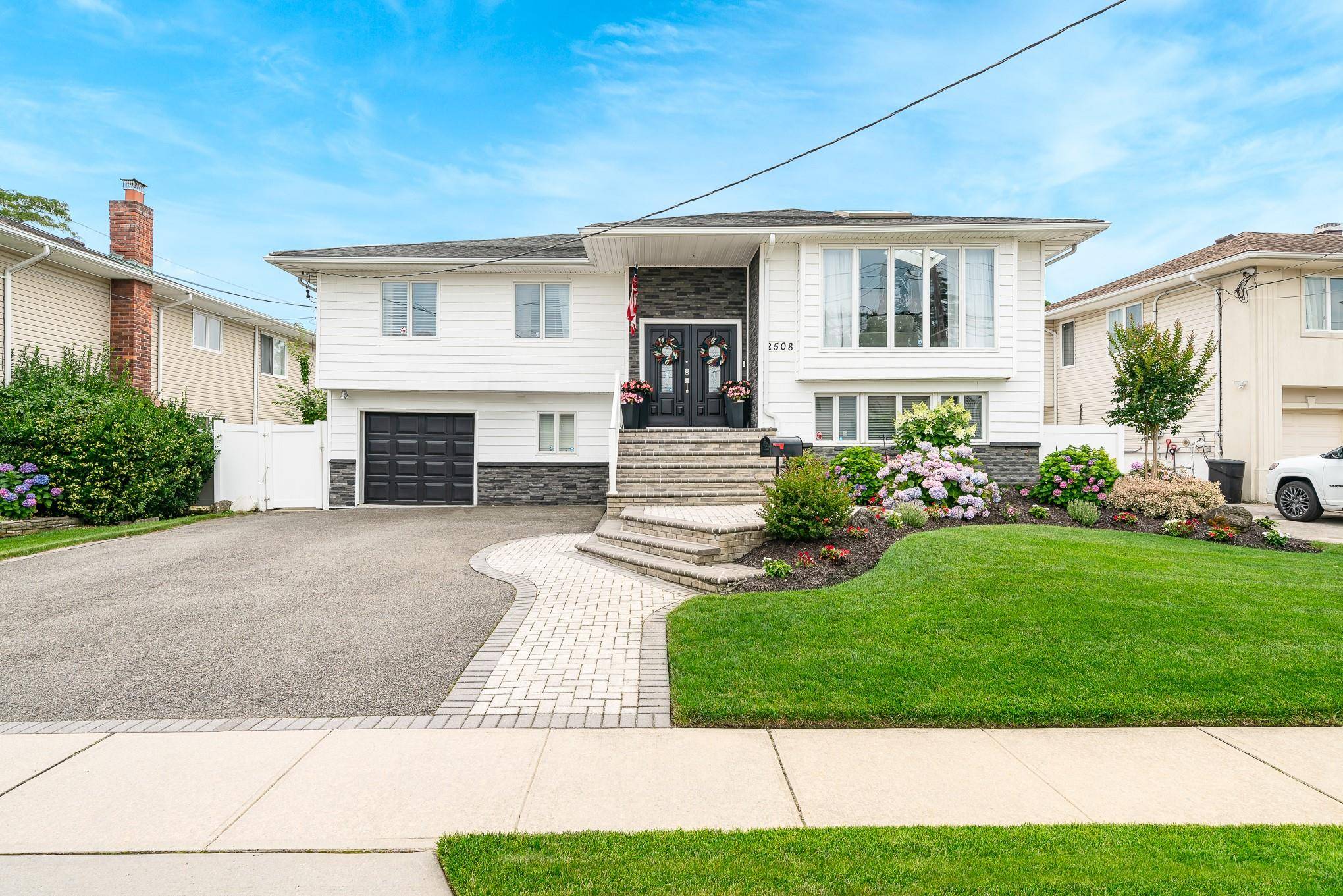 Beautiful and spacious 4 bedroom, 3 full bath raised ranch in desirable South Bellmore.