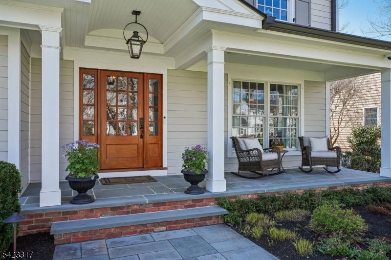 THIS HAPPY, SUN FILLED HOME IN CHATHAM'S COVETED WICKHAM WOODS OFFERS RESORT LIKE LIVING WITH UNPARALLELED STYLE, CHARM AND ATTENTION TO DETAIL !