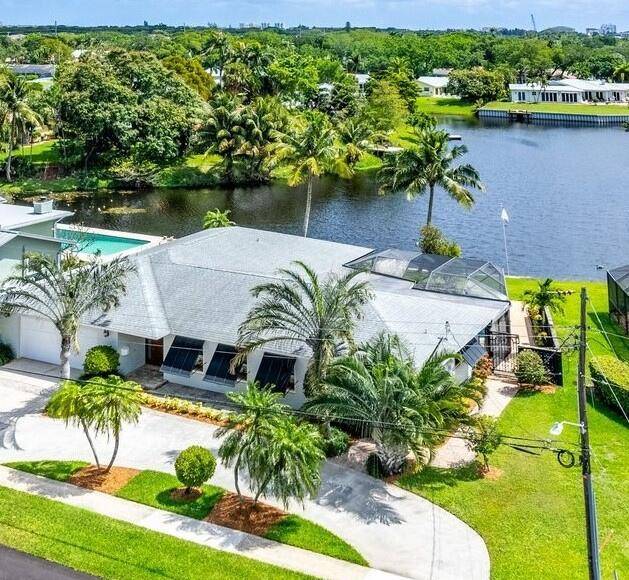 This exceptional property in East Boca boasts a prime location overlooking a picturesque lake.