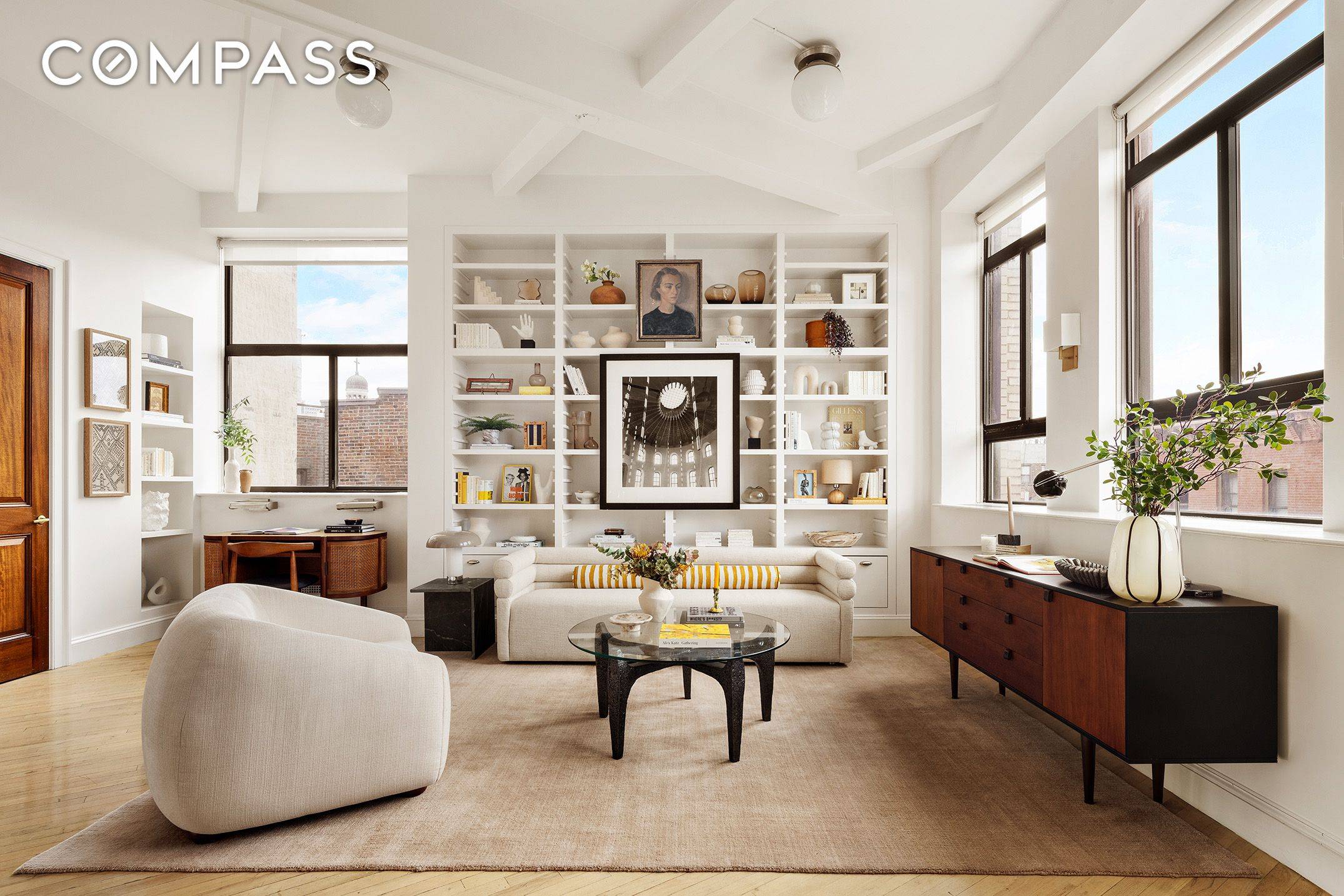 Embrace voluminous light and air in this stunning, architect renovated one bedroom loft in a full service West Village building.