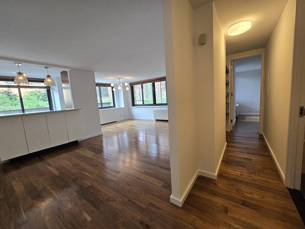 High end open layout split 2 bedroom with formal dining area and open Kitchen bar height counter.